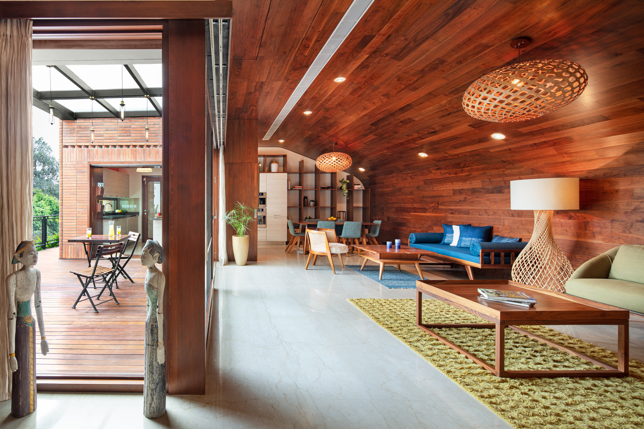 Warm wood interior with custom furniture at a Total Environment home