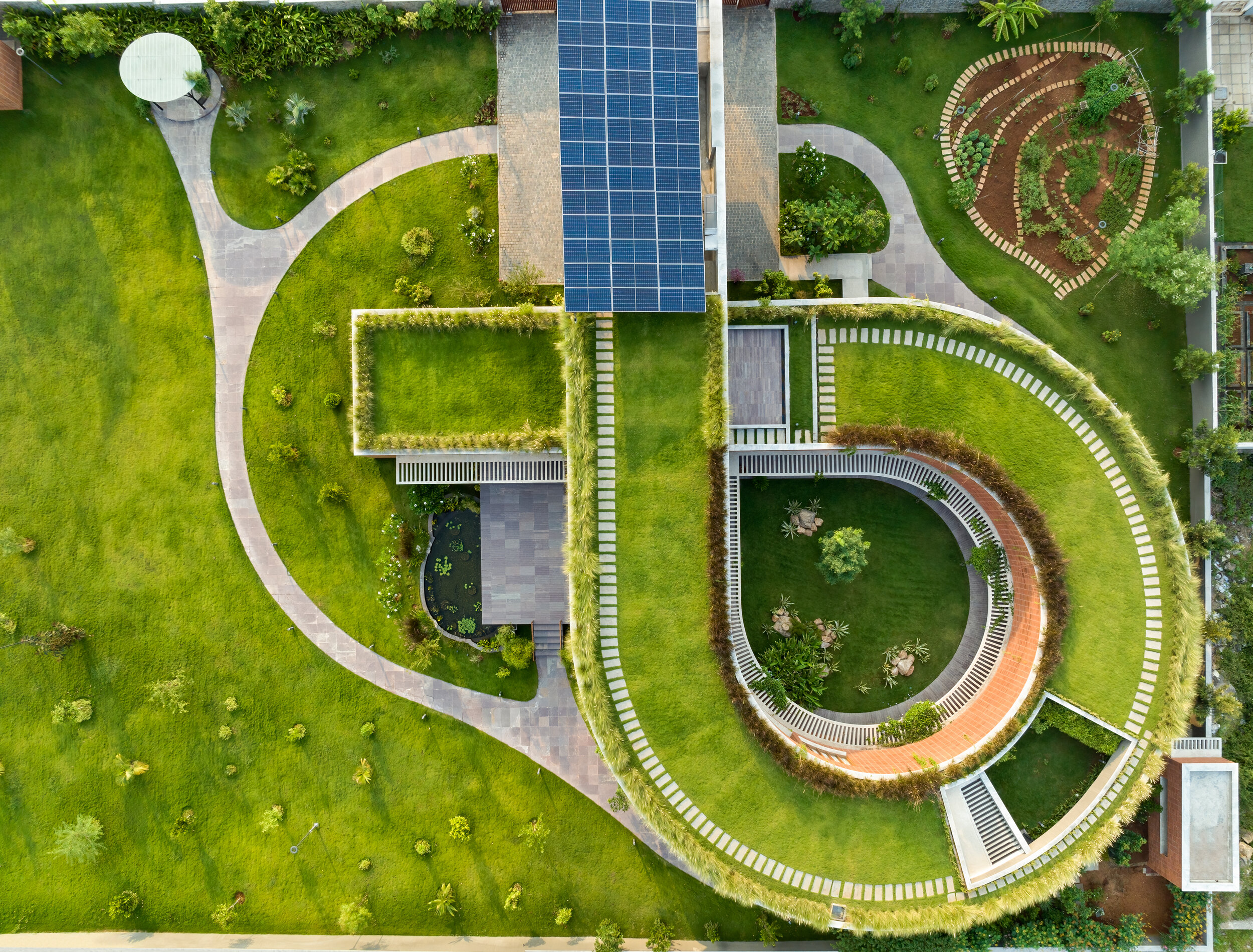 Aerial view of green-roofed villas at Total Environment's Bee House project in Bangalore