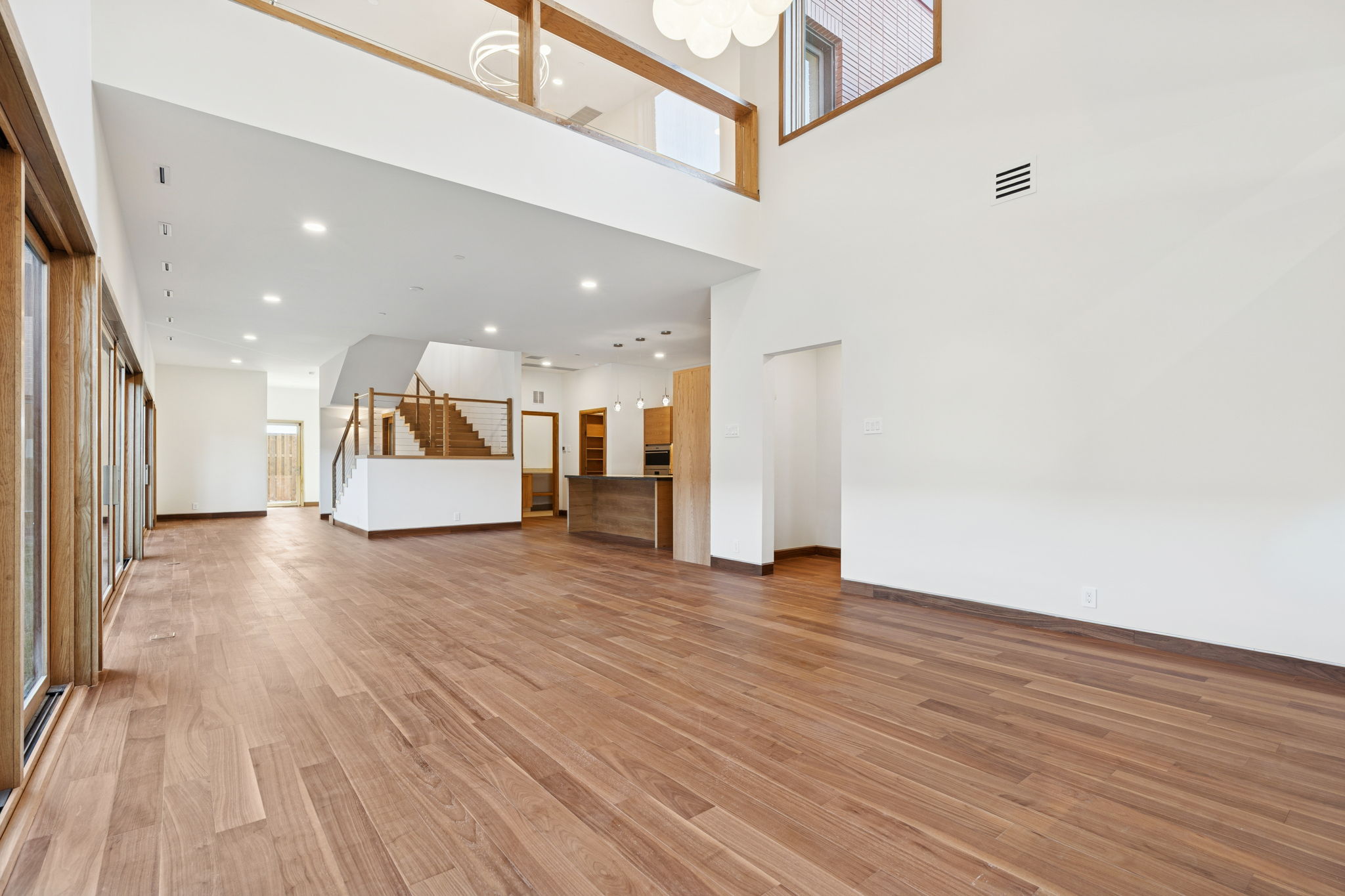 14867 Little Bluestem Ln - double-height living area with white oak floors
