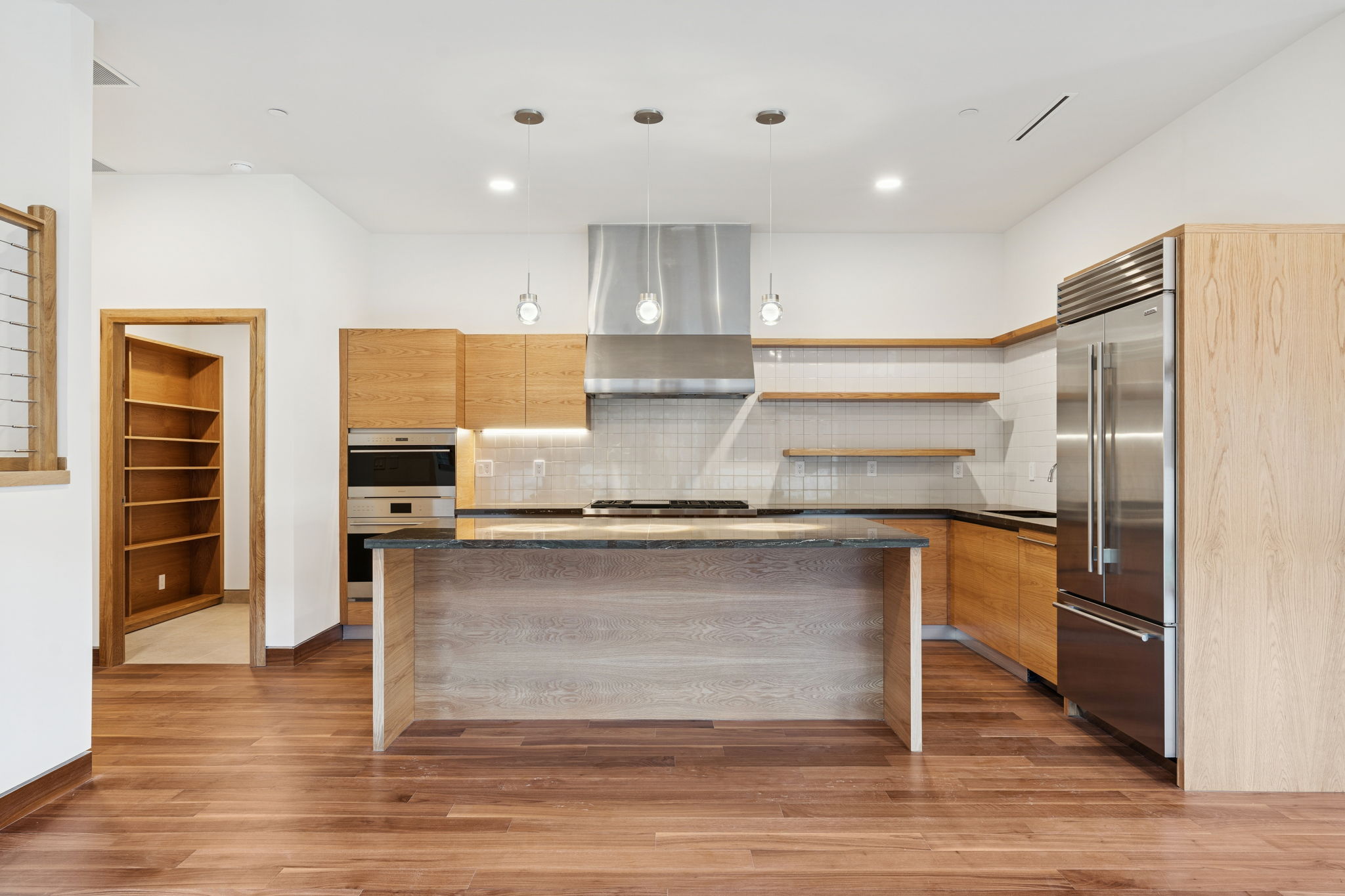 14867 Little Bluestem Ln - kitchen with oak cabinets and Wolf appliances